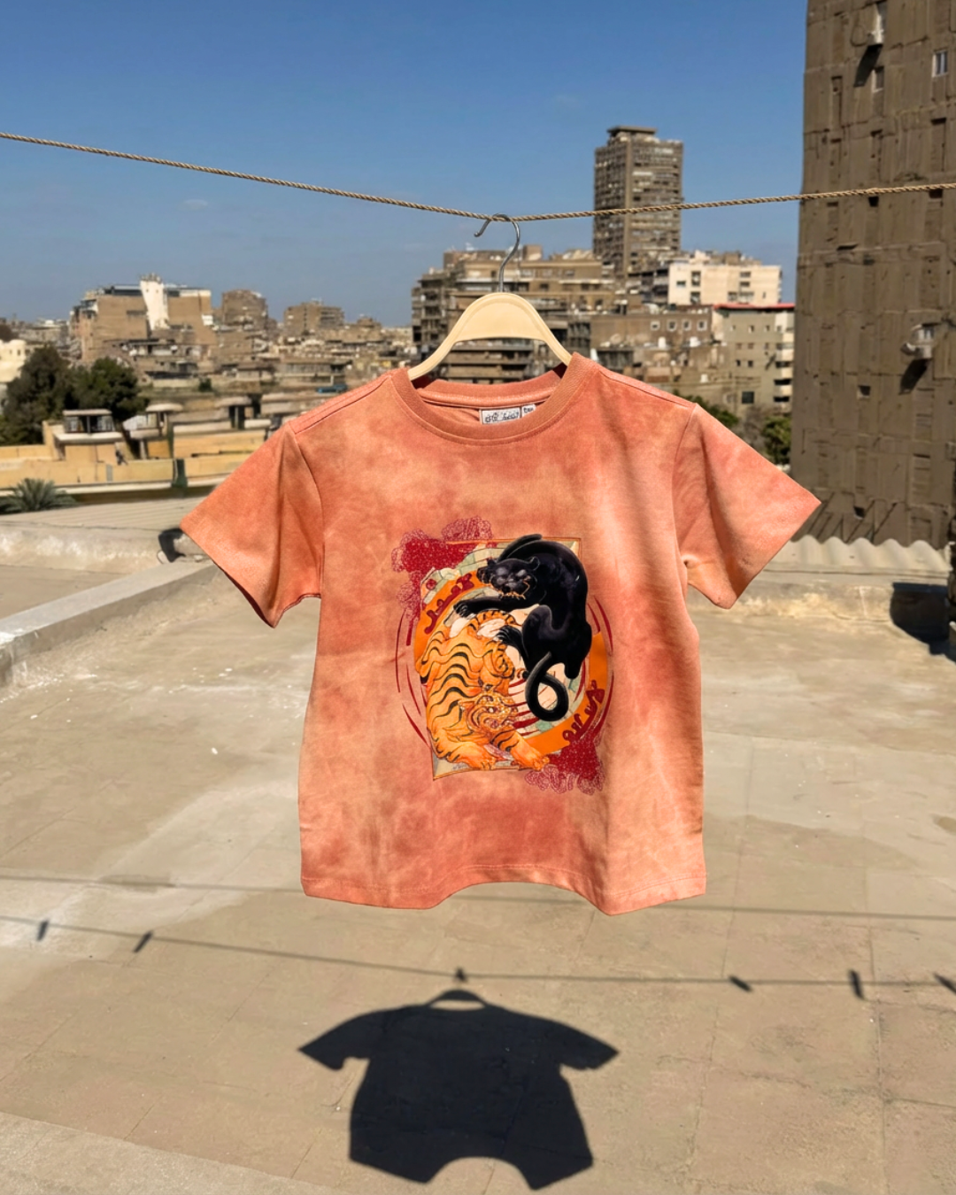 La 3adl La Salam Medium Crop Tee